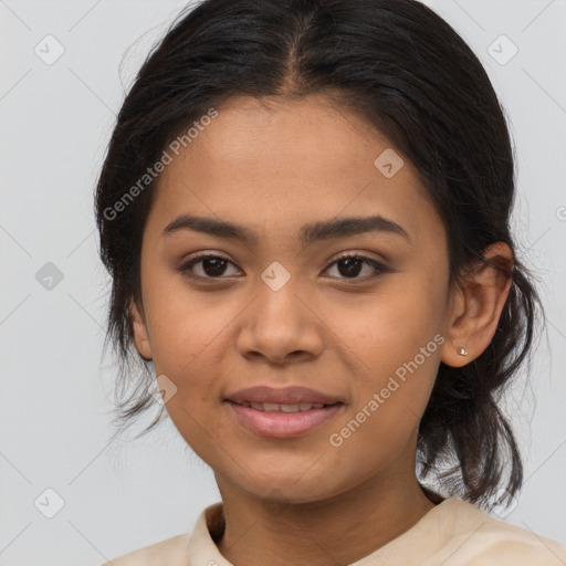 Joyful latino young-adult female with medium  brown hair and brown eyes