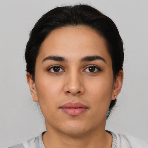 Neutral latino young-adult female with medium  black hair and brown eyes