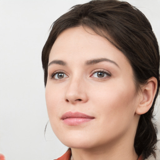 Neutral white young-adult female with medium  brown hair and brown eyes