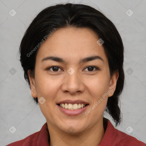 Joyful latino young-adult female with medium  brown hair and brown eyes