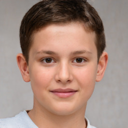 Joyful white child male with short  brown hair and brown eyes