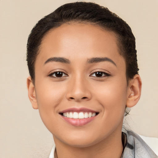 Joyful white young-adult female with short  brown hair and brown eyes