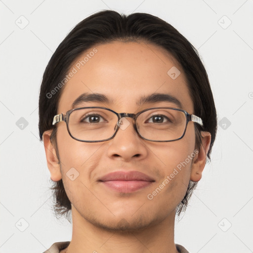 Joyful latino young-adult male with short  brown hair and brown eyes