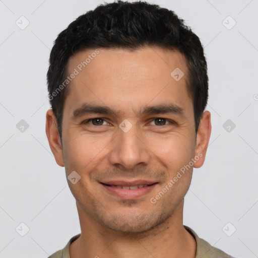 Joyful white young-adult male with short  black hair and brown eyes