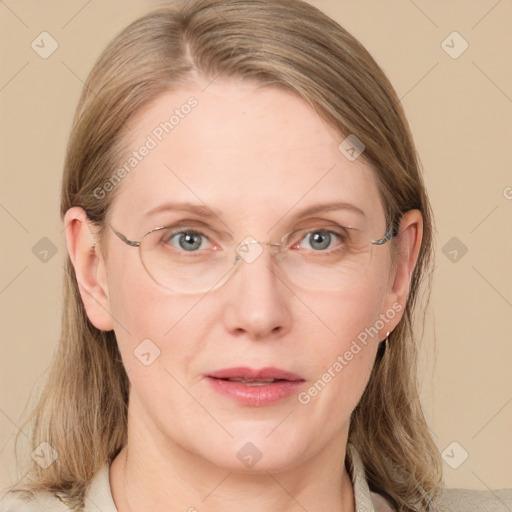 Joyful white adult female with medium  brown hair and blue eyes