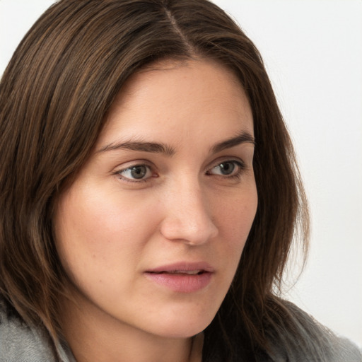 Neutral white young-adult female with long  brown hair and grey eyes