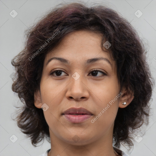 Joyful asian adult female with medium  brown hair and brown eyes