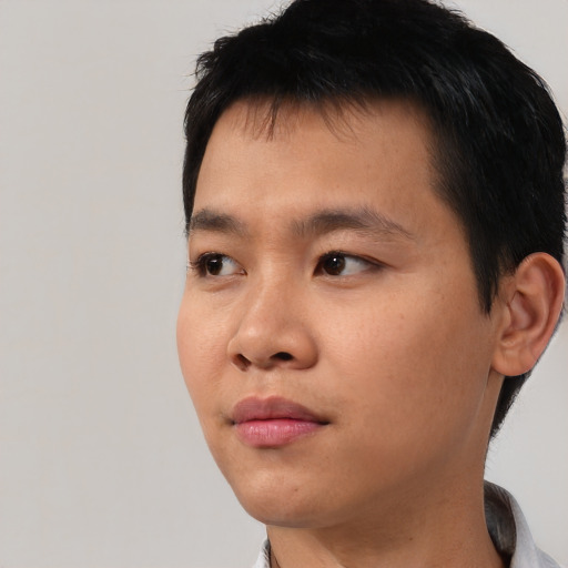 Neutral asian young-adult male with short  black hair and brown eyes