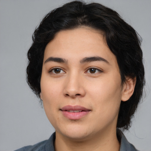 Joyful white young-adult female with medium  black hair and brown eyes