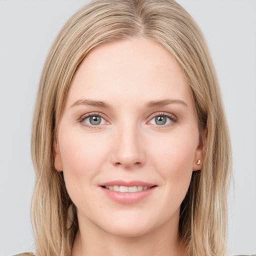 Joyful white young-adult female with long  brown hair and blue eyes