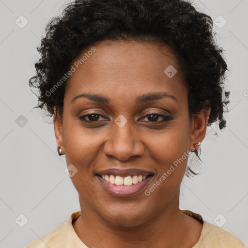 Joyful black young-adult female with short  brown hair and brown eyes