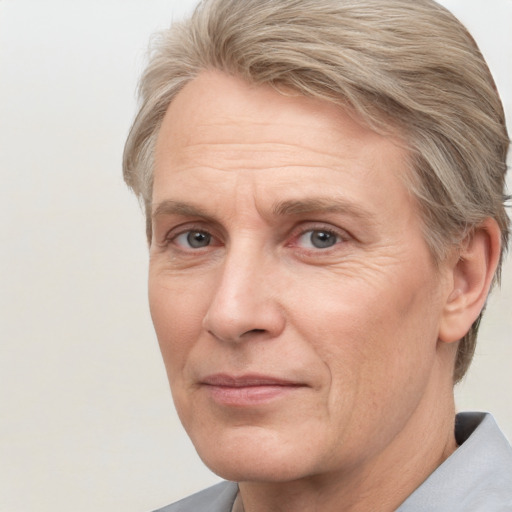 Joyful white adult male with short  brown hair and grey eyes