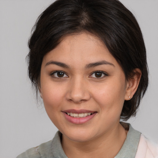 Joyful white young-adult female with medium  brown hair and brown eyes