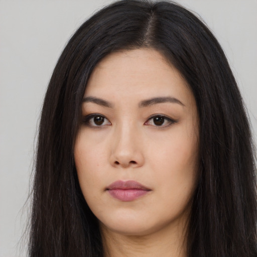 Neutral asian young-adult female with long  brown hair and brown eyes