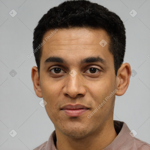 Joyful latino young-adult male with short  black hair and brown eyes