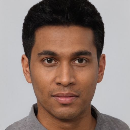 Neutral latino young-adult male with short  black hair and brown eyes