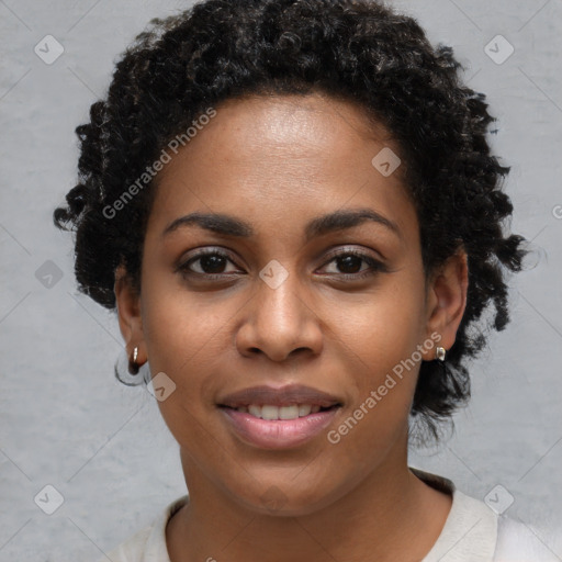 Joyful black young-adult female with short  black hair and brown eyes