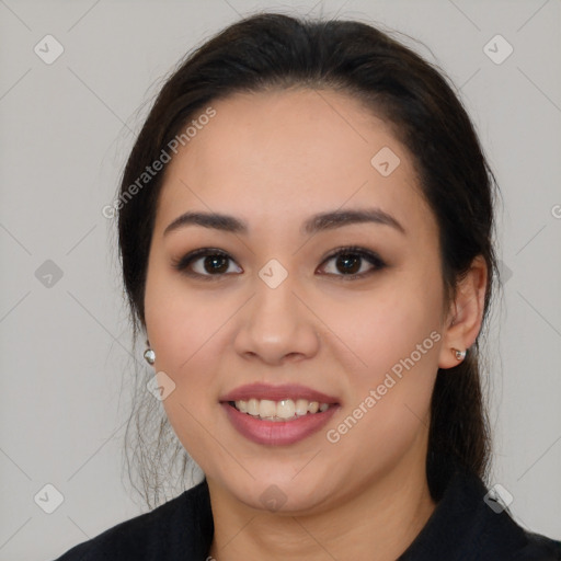 Joyful asian young-adult female with long  brown hair and brown eyes