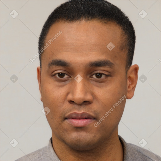 Neutral latino young-adult male with short  black hair and brown eyes
