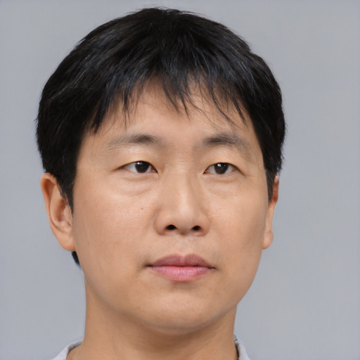 Neutral asian young-adult male with short  brown hair and brown eyes