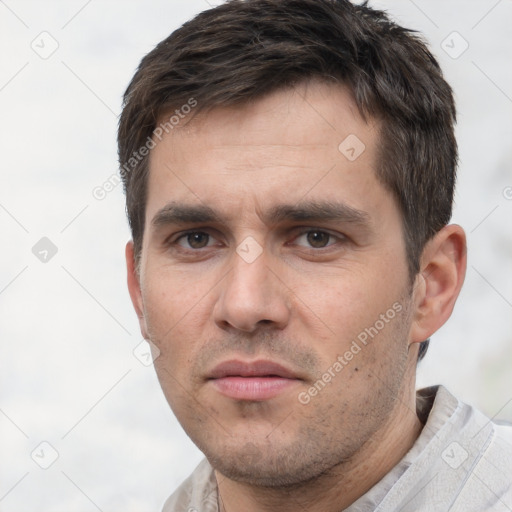 Neutral white young-adult male with short  brown hair and brown eyes