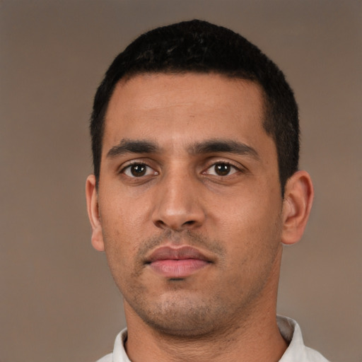 Neutral latino young-adult male with short  black hair and brown eyes