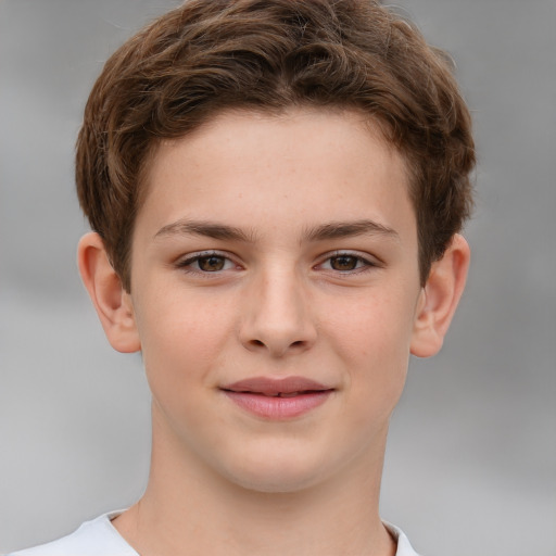 Joyful white child male with short  brown hair and brown eyes