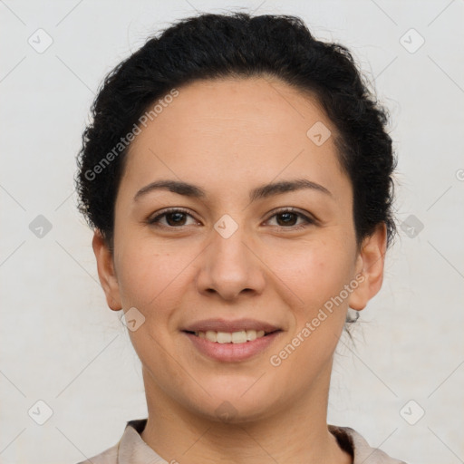 Joyful latino young-adult female with short  brown hair and brown eyes