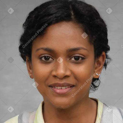 Joyful black young-adult female with short  black hair and brown eyes