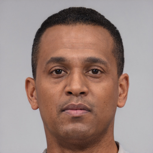 Neutral black young-adult male with short  brown hair and brown eyes