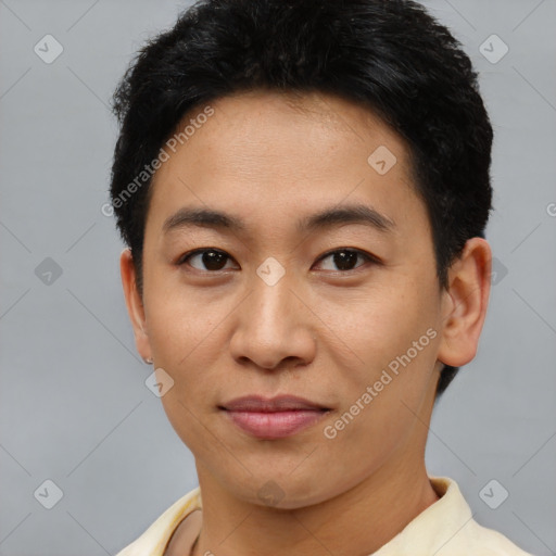 Joyful asian young-adult male with short  brown hair and brown eyes