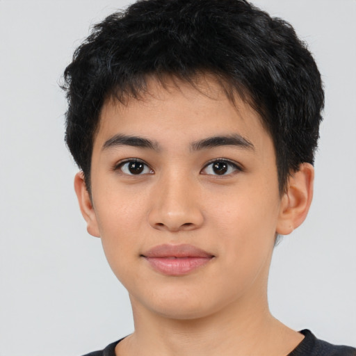 Joyful latino young-adult male with short  brown hair and brown eyes