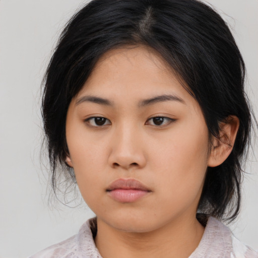 Neutral asian young-adult female with medium  black hair and brown eyes