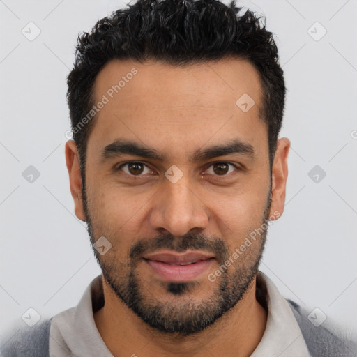 Joyful latino young-adult male with short  black hair and brown eyes