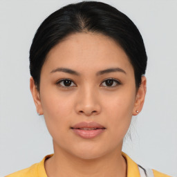 Joyful asian young-adult female with short  black hair and brown eyes