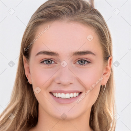 Joyful white young-adult female with long  brown hair and grey eyes