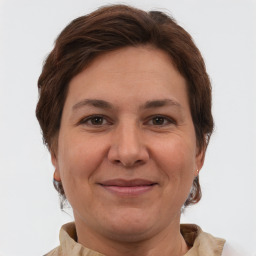 Joyful white adult female with short  brown hair and brown eyes