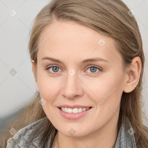 Joyful white young-adult female with long  brown hair and grey eyes