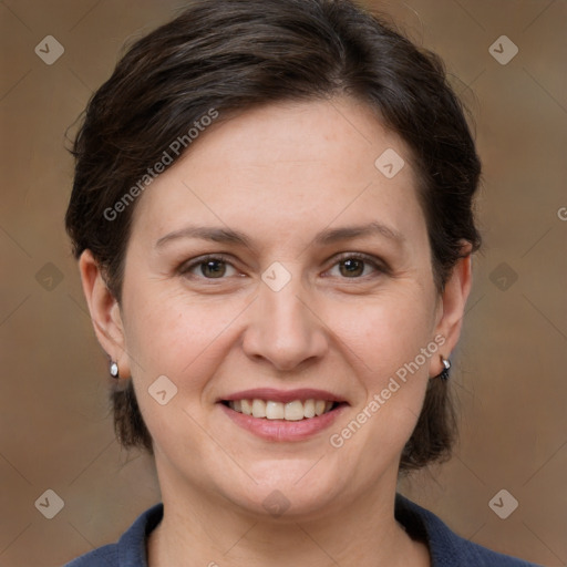 Joyful white adult female with medium  brown hair and grey eyes