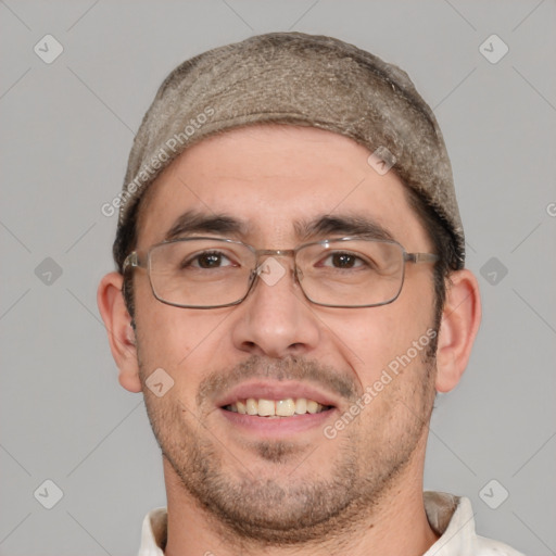 Joyful white adult male with short  brown hair and brown eyes