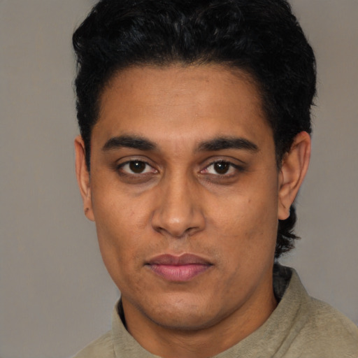 Neutral latino young-adult male with short  black hair and brown eyes