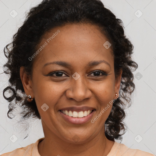 Joyful latino adult female with medium  brown hair and brown eyes