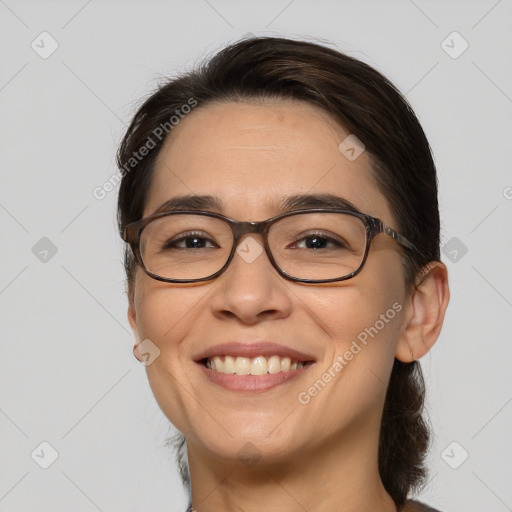 Joyful white adult female with medium  brown hair and brown eyes