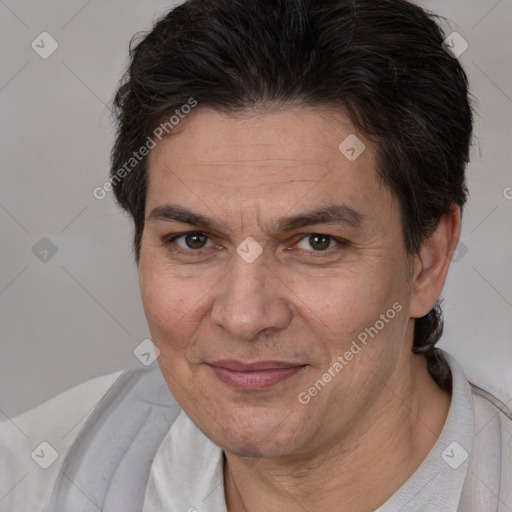 Joyful white adult male with short  brown hair and brown eyes