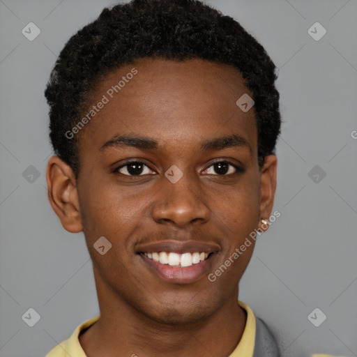 Joyful black young-adult male with short  brown hair and brown eyes