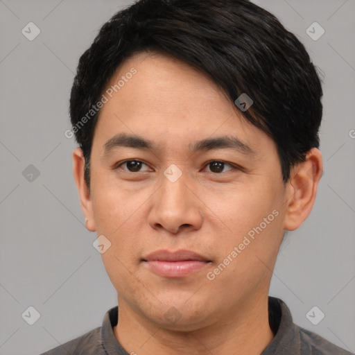 Joyful asian young-adult male with short  black hair and brown eyes