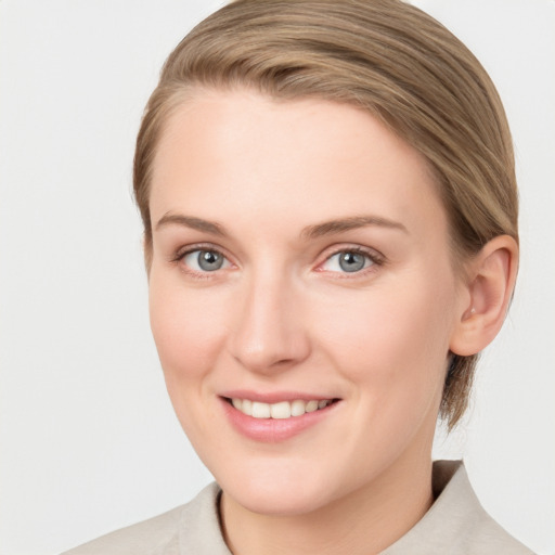 Joyful white young-adult female with medium  brown hair and blue eyes