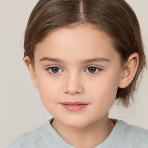 Joyful white child female with medium  brown hair and brown eyes