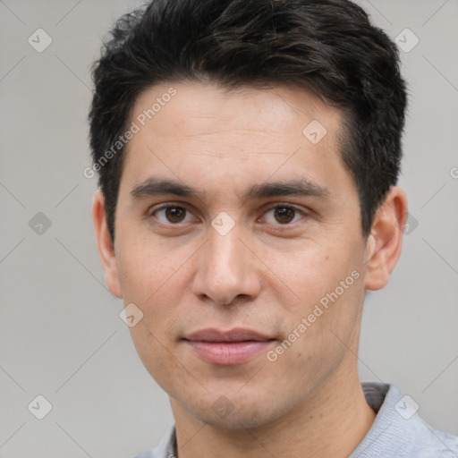 Joyful white young-adult male with short  black hair and brown eyes