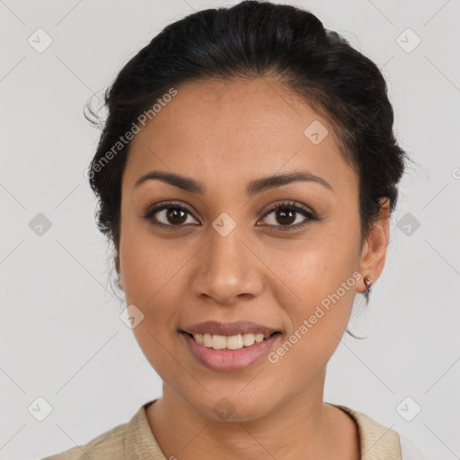 Joyful latino young-adult female with medium  brown hair and brown eyes